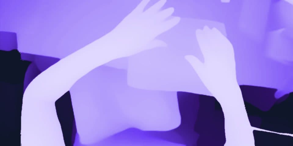 The same frame as a depth map, near surfaces light and far ones dark